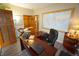 Functional home office with a large world map, desk, and a comfortable chair for work at 17722 E Ida Ave, Centennial, CO 80015