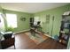 Bright home office with wood floors, large window, and functional desk setup, perfect for remote work or study at 17722 E Ida Ave, Centennial, CO 80015