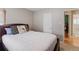 Comfortable bedroom with a large bed, neutral walls, and a peaceful ambiance at 2680 S Garfield Cir, Denver, CO 80210