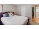 Bright bedroom with queen bed, access to a full bath, and an adjacent office at 2680 S Garfield Cir, Denver, CO 80210