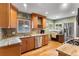 Charming kitchen with custom cabinets, stainless appliances, and a workstation at 2680 S Garfield Cir, Denver, CO 80210