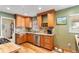 Spacious kitchen features wooden cabinets, stainless steel appliances, and light countertops at 2680 S Garfield Cir, Denver, CO 80210