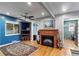 Cozy living room with a fireplace, blue accent wall, and an open layout at 2680 S Garfield Cir, Denver, CO 80210