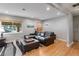 Bright living room featuring hardwood floors, a window, and a view of the neighborhood at 2680 S Garfield Cir, Denver, CO 80210