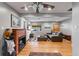 Inviting living room with hardwood floors, fireplace, and a comfortable leather sectional at 2680 S Garfield Cir, Denver, CO 80210