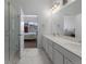 Elegant bathroom with double vanity, large mirror, and a walk-in shower at 9287 Twenty Mile Rd # 401, Parker, CO 80134
