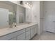 Modern bathroom featuring a double vanity, a walk in shower, and marble flooring at 9287 Twenty Mile Rd # 401, Parker, CO 80134