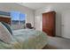 Bedroom with a queen bed and large closet at 9287 Twenty Mile Rd # 401, Parker, CO 80134