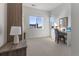 Well-lit bedroom with a desk, window, and closet at 9287 Twenty Mile Rd # 401, Parker, CO 80134