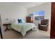 Bedroom with a comfy recliner and large closet at 9287 Twenty Mile Rd # 401, Parker, CO 80134