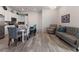 Open concept dining area with kitchen and living room views at 9287 Twenty Mile Rd # 401, Parker, CO 80134