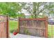 Fenced back yard with grass and a view of other homes at 18324 E Bethany Pl, Aurora, CO 80013