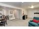 Finished basement featuring a kitchenette, seating area, and ample storage space at 18324 E Bethany Pl, Aurora, CO 80013