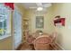 Cozy breakfast nook with windows, table and chairs and a view of the yard at 18324 E Bethany Pl, Aurora, CO 80013