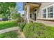 Beautifully landscaped front yard with lush greenery, flowering plants, and a welcoming walkway at 18324 E Bethany Pl, Aurora, CO 80013