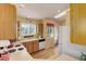 Sunlit kitchen featuring wood floors, updated appliances, and plenty of counter space at 18324 E Bethany Pl, Aurora, CO 80013