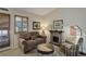 Comfortable living room with stone fireplace, a couch, and good natural light at 18324 E Bethany Pl, Aurora, CO 80013