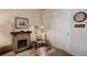 Living room with fireplace, chair, storage and neutral colored walls at 18324 E Bethany Pl, Aurora, CO 80013