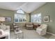 Bright living room with vaulted ceilings, shuttered windows, and neutral decor at 18324 E Bethany Pl, Aurora, CO 80013