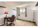 Bedroom featuring a desk, a window, and a chair at 8613 Santa Fe Dr, Thornton, CO 80260