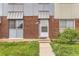 Townhouse brick entry with decorative door and awning provides curb appeal and charm at 8613 Santa Fe Dr, Thornton, CO 80260