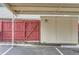 Carport parking area featuring a red wooden gate at 8613 Santa Fe Dr, Thornton, CO 80260