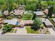 Aerial view showcasing a well-maintained home with a large yard, established trees, and a desirable neighborhood setting at 5920 Garrison St, Arvada, CO 80004