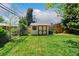Well-maintained backyard featuring a shed, lush green lawn, and privacy fence, offering a serene outdoor space at 5920 Garrison St, Arvada, CO 80004
