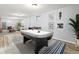 Finished basement with an air hockey table, framed prints, and access to a separate living area at 5920 Garrison St, Arvada, CO 80004