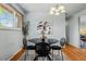 Elegant dining room with a round table, stylish chairs, and a modern chandelier, ideal for gatherings at 5920 Garrison St, Arvada, CO 80004