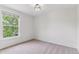 Well-lit bedroom featuring modern light fixture, carpet, and natural lighting at 2566 N Emerson St, Denver, CO 80205
