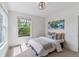 Bright bedroom with a window view, neutral decor, carpet flooring, and a cozy atmosphere at 2566 N Emerson St, Denver, CO 80205