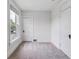 Bright bedroom with neutral carpet, paint, and white doors and trim at 2566 N Emerson St, Denver, CO 80205