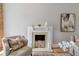 Close-up of a charming fireplace with decorative accents, providing a warm and inviting focal point in the living area at 2566 N Emerson St, Denver, CO 80205