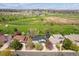 Enjoy living near a golf course in this neighborhood, as seen in this aerial view showcasing its proximity and lush greenery at 12391 E Cedar Cir, Aurora, CO 80012