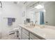 Bright bathroom with a shower, vanity, and updated fixtures at 12391 E Cedar Cir, Aurora, CO 80012
