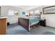 Bedroom showcasing a comfortable bed and ample natural light from the windows at 12391 E Cedar Cir, Aurora, CO 80012