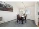 Cozy dining area with modern lighting fixture and bright window at 12391 E Cedar Cir, Aurora, CO 80012
