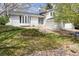 Well-manicured front yard complements this charming home featuring stone accents and a welcoming entrance at 12391 E Cedar Cir, Aurora, CO 80012