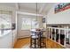 Eat-in kitchen with white cabinetry, island, and scenic views at 12391 E Cedar Cir, Aurora, CO 80012