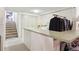 Clean laundry room with modern appliances and a folding counter for convenience at 12391 E Cedar Cir, Aurora, CO 80012