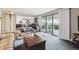 Cozy living room with sliding glass doors and view of the upper level at 12391 E Cedar Cir, Aurora, CO 80012