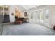 Spacious living room featuring a vaulted ceiling, a bay window with views of the outdoors, and comfortable seating at 12391 E Cedar Cir, Aurora, CO 80012