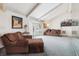Bright living room featuring large windows, vaulted ceiling, and comfortable seating at 12391 E Cedar Cir, Aurora, CO 80012