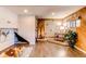 Unique basement decor with brick details, wood paneling, and decorative tile, perfect for a cozy retreat at 753 S Utica St, Denver, CO 80219
