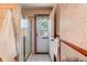 Bathroom featuring tiled walls, a glass-enclosed shower, and a door to the outside at 753 S Utica St, Denver, CO 80219