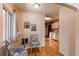 Charming dining area with hardwood floors leading to a bright kitchen and cozy seating at 753 S Utica St, Denver, CO 80219
