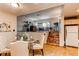 Well-appointed dining room with seating for four, with easy access to kitchen and living room at 753 S Utica St, Denver, CO 80219