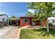 Charming single Gathering home exterior with green lawn, walkway and attached carport at 753 S Utica St, Denver, CO 80219