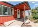 Inviting covered front porch with access ramp, showcasing a charming and accessible home entrance at 753 S Utica St, Denver, CO 80219